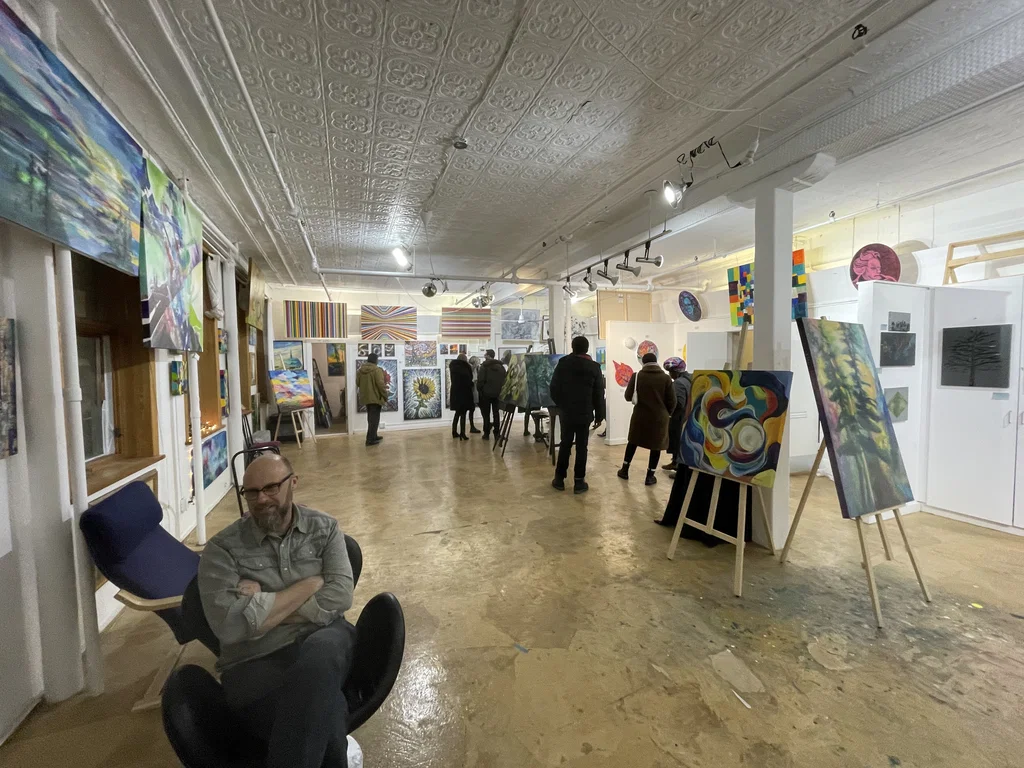 People standing in art gallery space
