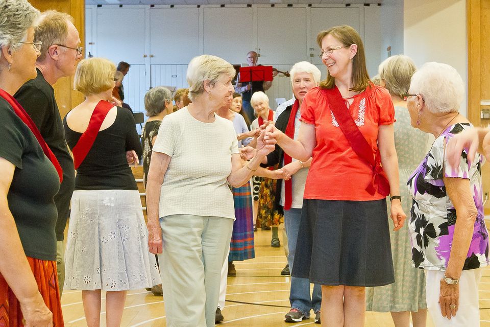 people holding hands in dance line